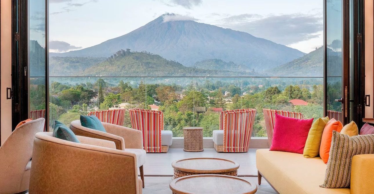 Gran Melia Arusha luxury terrace with vibrant cushions and a wide Mount Meru view in Arusha 5 Best Hotels in Arusha 2026: Where to Stay Before Your Safari