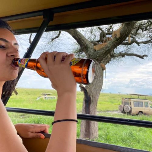drinking beer with Climb Kilimanjaro and Safaris with our guest in Serengeti national park for funny