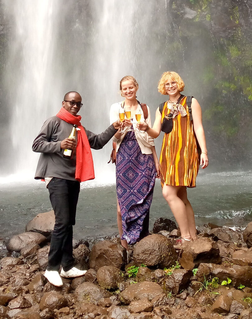 materuni waterfalls Stanley Ayo cheers with Magdalena and Elena