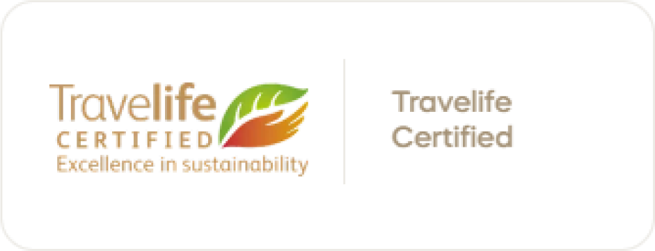Travelife Certified badge with a left logo and leaf icon, and the text 'Travelife Certified' on a black background.